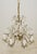 Rococo Revival crystal chandelier with eight arms. French cut icicle prisms hang from the scalloped bobeches and lower...