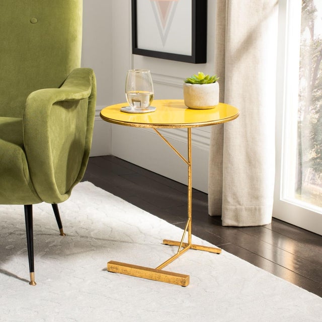 Revitalize any living space with this bold Sionne Round C Table. Sionne's industrial-style legs are given a dramatically...