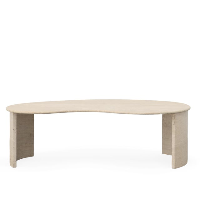 With it's soft, fluid shape the Anders cocktail table is a modern, organic form. A kidney bean shaped top is hand carved...
