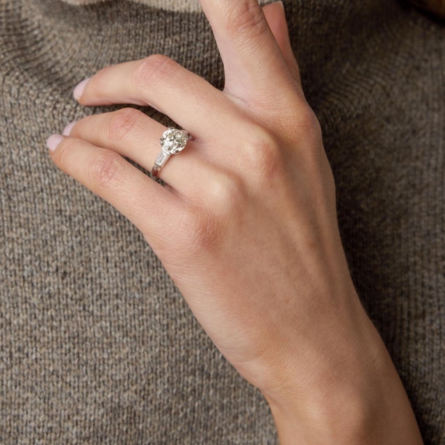 A breathtaking emblem of 1920s sophistication, this authentic Art Deco engagement ring showcases a commanding 2.63 carat...