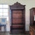 This Gorgeous 19th Century French Oak Carved Bookcase With Turned Supports and Decorative Frieze has 2 large doors and a...