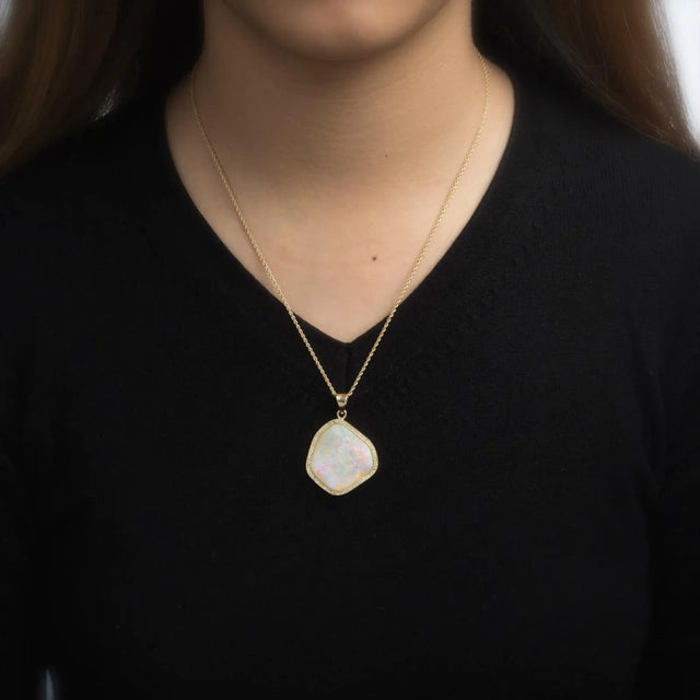This is part of Chairish’s Fine Jewelry assortment. Stylish opal & diamond pendant, crafted in 18 karat yellow gold...