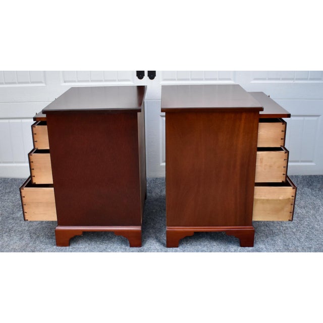 Vintage : (1980's) Pair of Nightstands/Chests have a Chippendale Style. The Wood is Mahogany. The nightstands have Three...