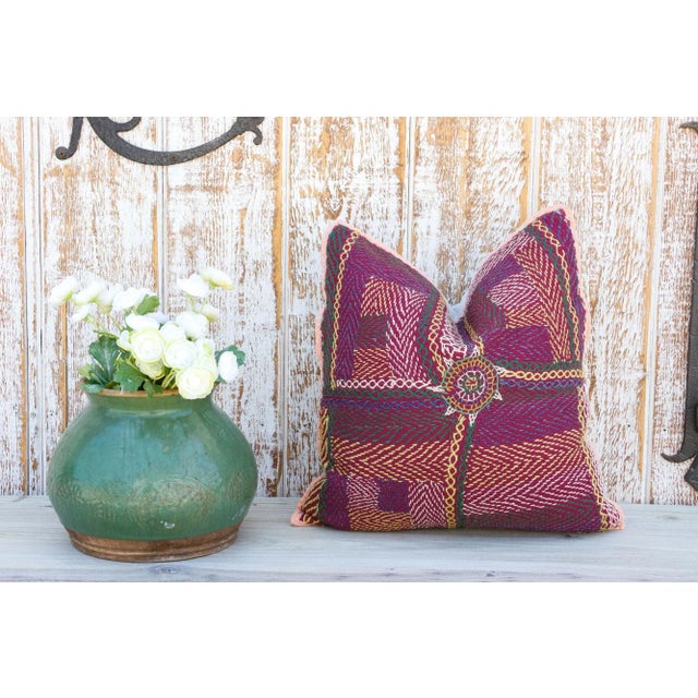 Quilted by the gypsy woman of the Saami community often reusing fabrics from clothing. This antique tribal pillow feature...