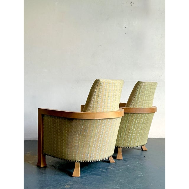 Discover this charming pair of vintage lounge chairs, perfect for adding a touch of bohemian elegance and comfortable...