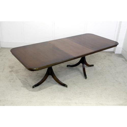 You are viewing an elegant Regency Revival dining table with matching set of 8 chairs The table features a gently rounded...