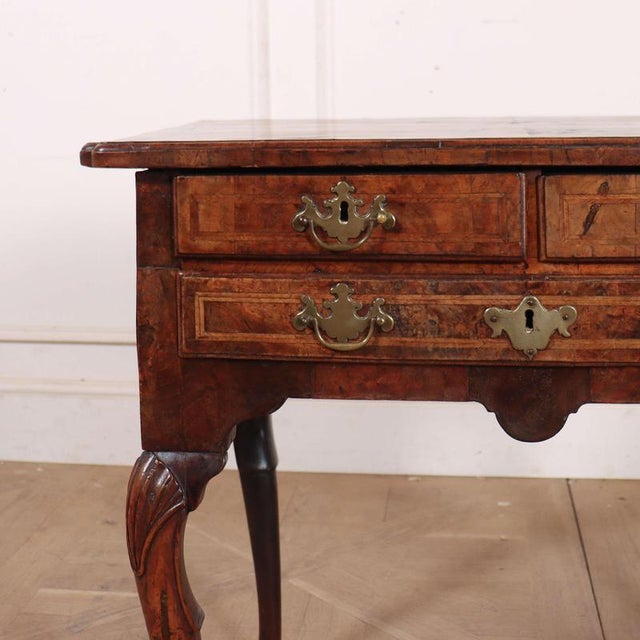 Early 18th C walnut 3 drawer lowboy/ lamp table. 1740 This piece is designed in the style of the selected designer and/or...