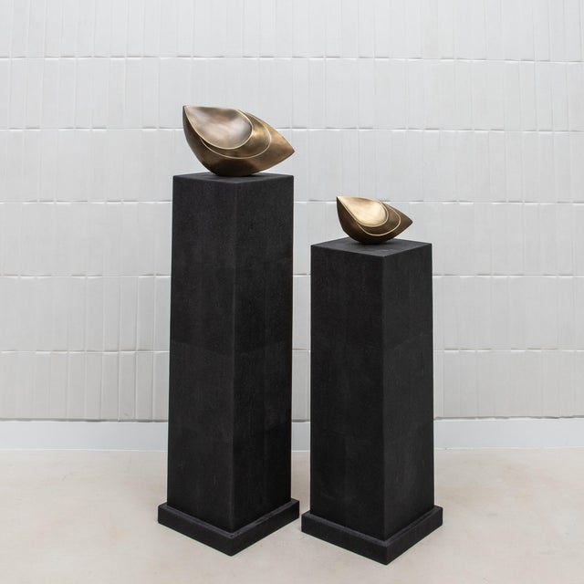 The Modern Classic Column in Black Shagreen by R&Y Augousti is a refined display piece that exudes minimalist elegance....