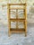 Vintage, bamboo, rattan and wicker, 3-tiered floor shelf, circa 1970's. piece has three shelves made of golden...