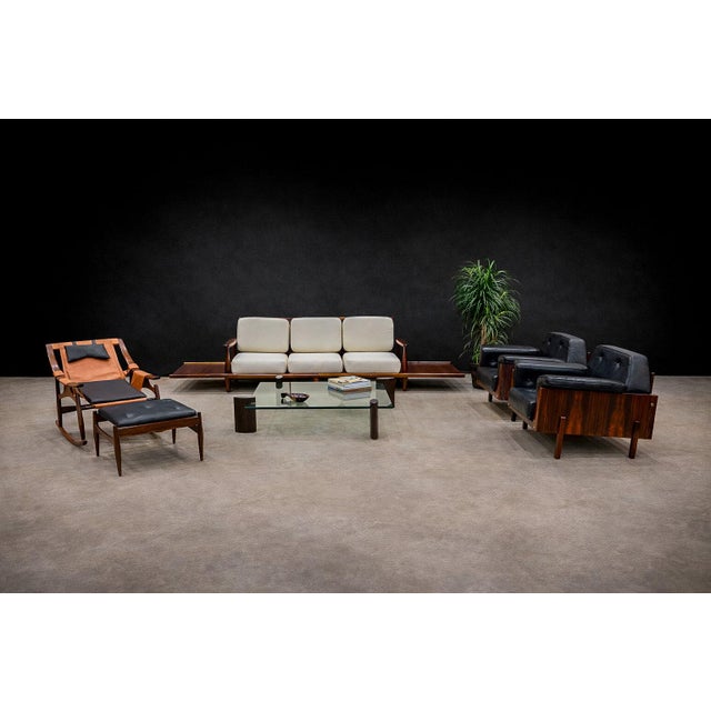 These unique looking armchairs feature a square base made in Brazilian rosewood (Jacaranda). They have been upholstered in...