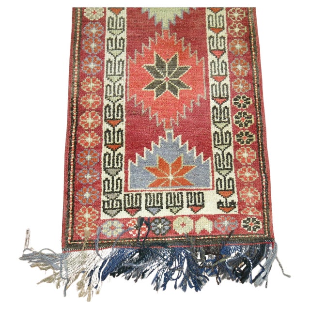 A Turkish anatolian runner from the middle of the 20th century. Measures: 2'7” x 13'9”.