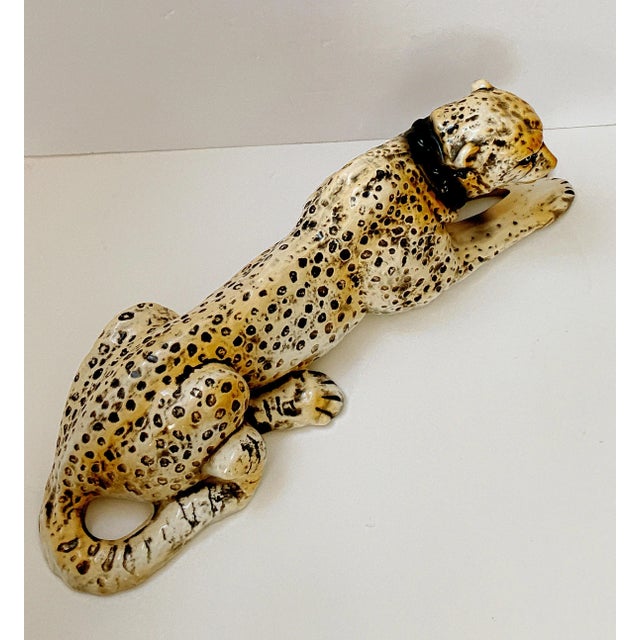 A striking vintage 1970 California Pottery leopard cat sculpture, hand-painted and finished in a luminous crackle glaze of...