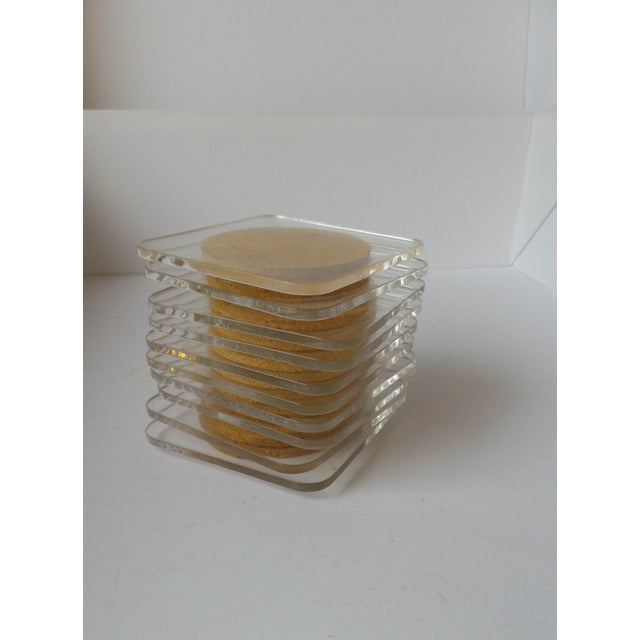Clear acrylic coaster set. Cork on one side which can be used up or down. Rounded corners. Set of 10.