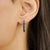 These elegant earrings are crafted in 925 sterling silver and feature a sleek vertical bar design set with natural square-...