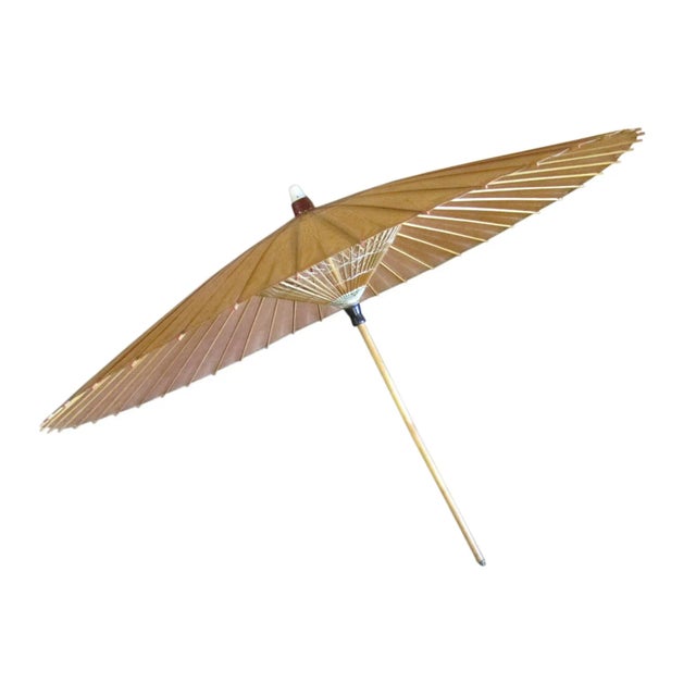 An exquisite vintage Chinese lacquer and rice paper parasol. This stunning piece showcases the artistry of Chinese...
