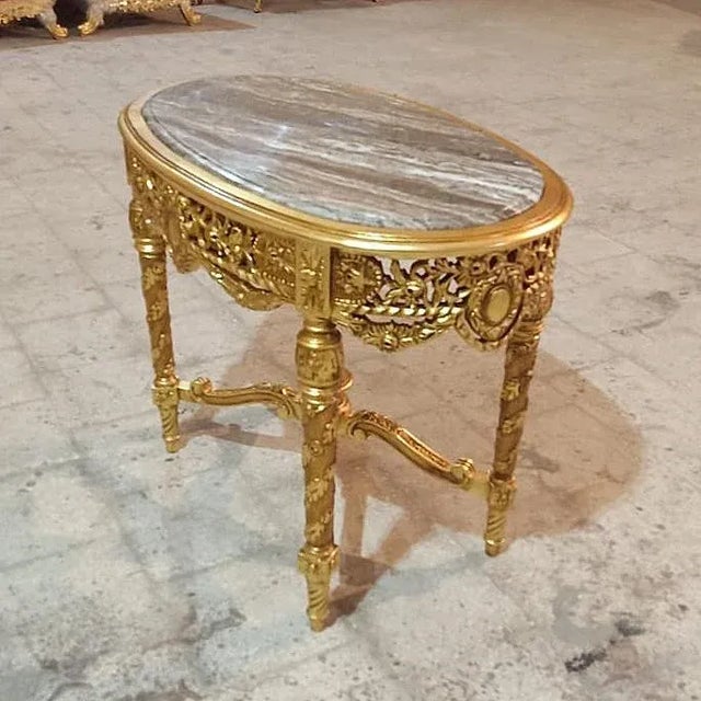 Stunning details. Beautiful table with gold details. Elegance assured. This gold table is the perfect piece to add glitz,...