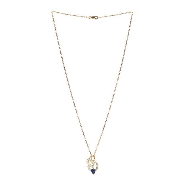 Stones: sapphire pear 6 x 4.5 mm .55ctw diamond round brilliant cut .12ctw GH color/SI2-I1 clarity tapered baguette .30ctw...