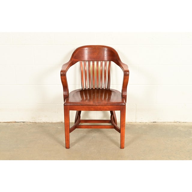 An exceptional antique Mission or Arts & Crafts period carved walnut banker, juror, or lawyer chair By B.L. Marble Chair...