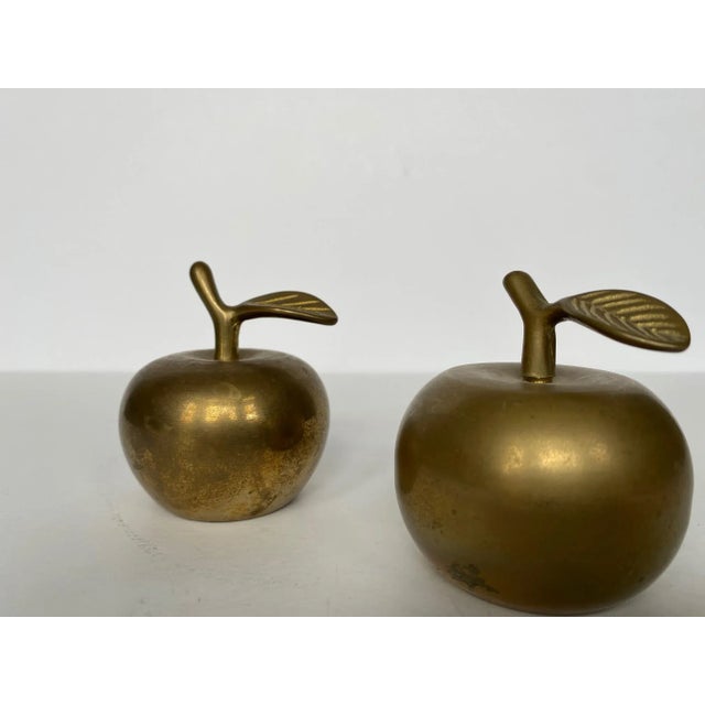 Cute set of solid brass apple bells. Perfect addition to a desk or bookshelf.