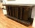 A fabulous vintage hand hammered credenza with plates riveted to a wood frame. There are 4 doors with 4 long handles. Each...