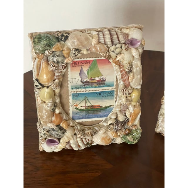 Lovely pair of vintage sea shells encrusted photo encrusted sailors valentines photo frames with marine images.