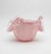 A striking vintage Italian art glass bowl featuring a soft pink body encased in substantial clear glass and formed into a...