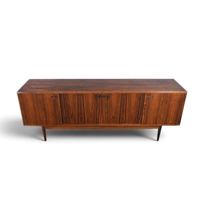 This credenza was designed by Johannes Andersen and produced by Christian Linneberg in Denmark during the 1960s. The...