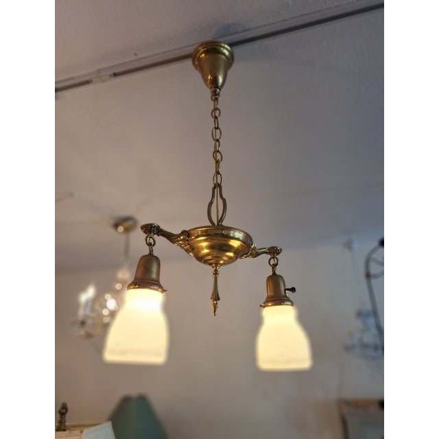 An Authentic 2 Light Edwardian Aladdin Pan Fixture with 2 Antique milk glass colonial Glass Shades. The fixture is solid...