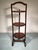 A turn of the 20th century English three-tiered inlaid mahogany muffin stand traditionally used by hotels and bakeries...