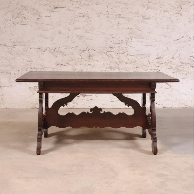 This 19th Century French Walnut Desk is a refined antique that exemplifies the elegance and craftsmanship of classic...