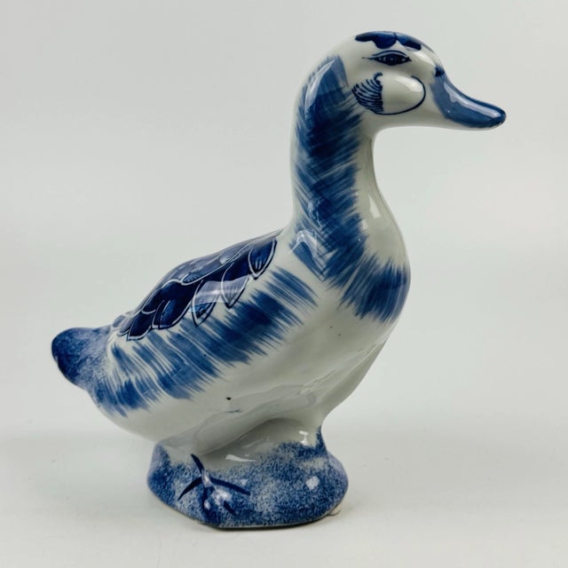 Add classic Dutch-inspired charm to your collection with this vintage Delft-style blue and white porcelain duck/goose...