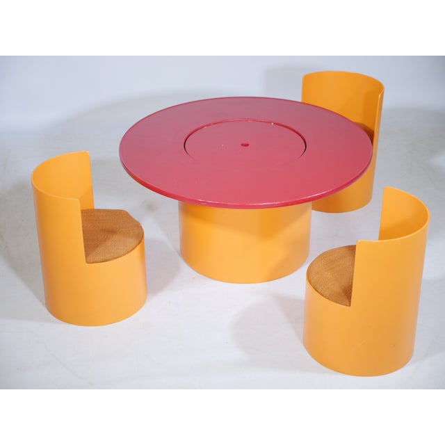 Stylish space age children's chairs and table set. The table can be opened in the middle for storage space. The chairs...