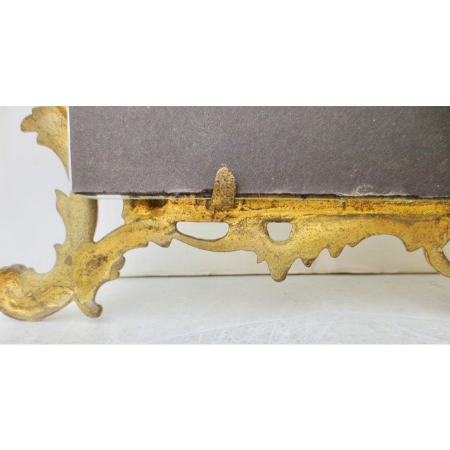 Victorian Brass Frame in the Rococo manner. Elaborate architectural frame with stairs, columns, and balustrade. Also,...