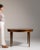 Oval walnut dining table in Rich Walnut Brown. Its rich walnut brown finish sets off tapered fluted legs, oval top, a...