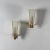 An early edition signed pair of Stilnovo wall sconces, Italy, circa 1950s. Each sconce features a frosted glass shade with...
