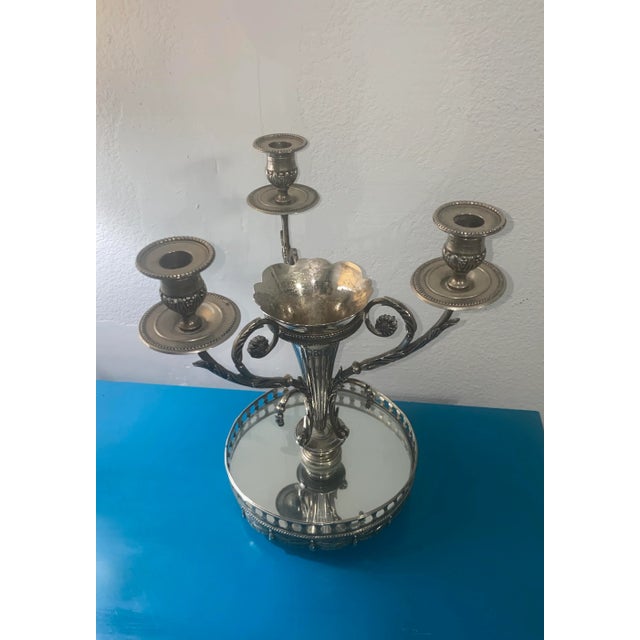 Vintage centerpiece candle holder with vase, made by Godinger. The center vase is surrounded by three candle holders with...