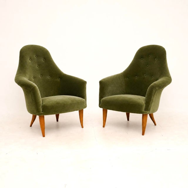 An absolutely stunning and very rare pair of vintage Swedish armchairs by Kerstin Horlin Holmquist. This model is called...