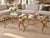 Offered as a matching pair, these substantial vintage end tables unite sculptural metalwork, original gold-leaf finish,...
