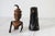Vintage African folk art sculpture or doll carved from wood and dark horn. The figure features a distinct topknot of hair...
