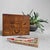 A refined Japanese haribako, or traditional sewing box, with richly figured wood, warm amber-brown tones and a practical...
