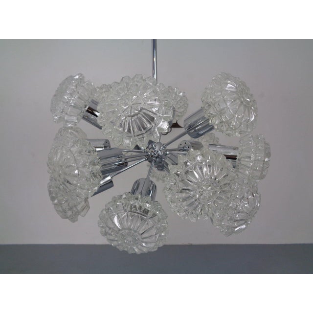 Chrome-plated Sputnik lamp by Richard Essig with 18 glass shades from the 1960s. Some glass shades have minimal, invisible...