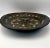 A striking early 20th-century Moroccan Kasriya, or traditional communal serving bowl, hand-carved in wood and richly...