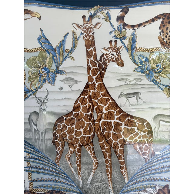 A stunning large-format framed Salvatore Ferragamo silk scarf showcasing the Italian luxury house's iconic African safari...