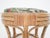 Round bamboo stool with a new cushion with a flower pattern.