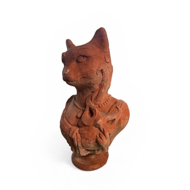 This captivating vintage terracotta bust features an elegantly rendered anthropomorphic cat, blending classical sculptural...