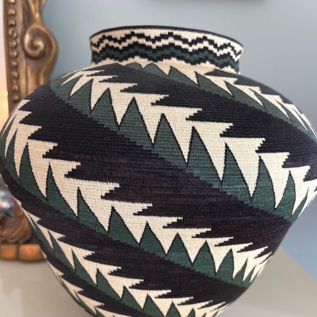 Beautiful handwoven Wounaan Rainforest basket made from the finest palm fibers. Featuring an architectural grid design...