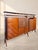 This Italian Mid-Century bar cabinet, produced by La Permanente Mobili Cantù during the 1950s–60s, is defined by an...
