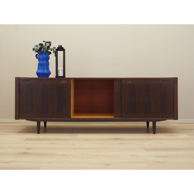 The sideboard was made in the 1970s by the renowned Danish manufacturer Skovby Møbelfabrik. The structure is covered with...