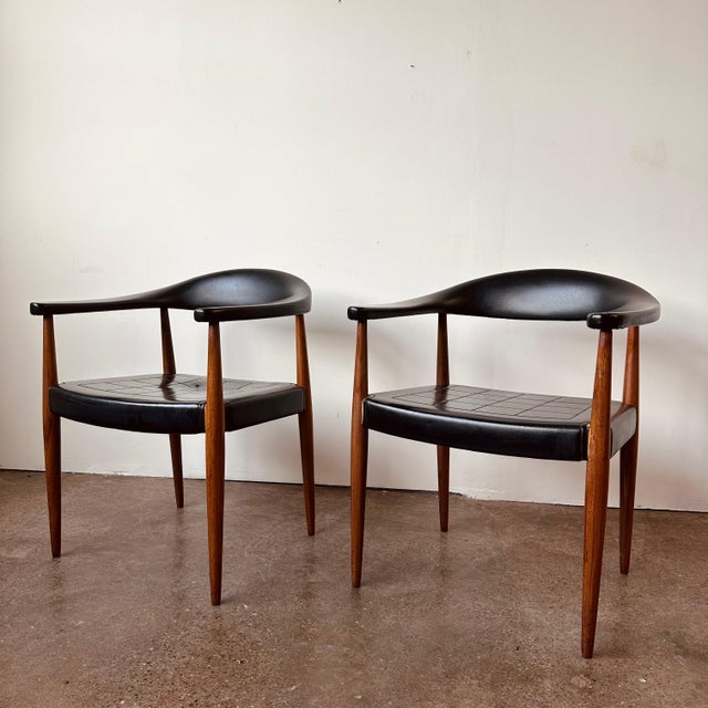 A rare set of vintage barrelback arm chairs designed by Ilmari Lappalainen for Asko of Finland circa 1960s. Made of solid...
