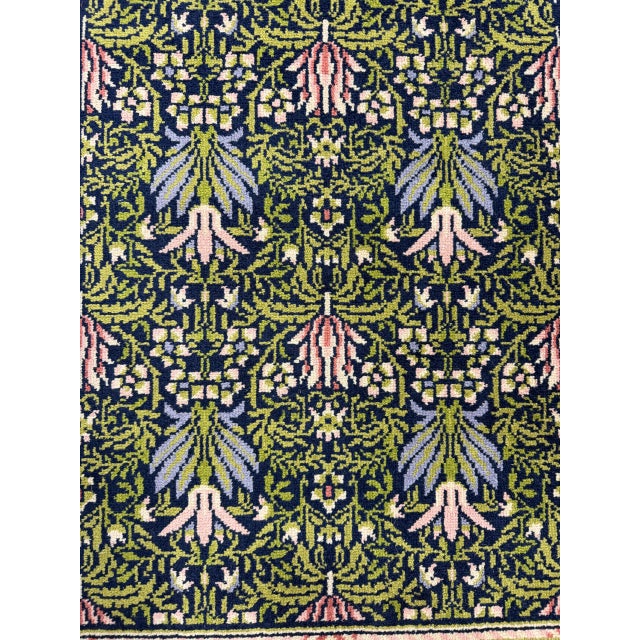 Limited edition Wilton woven rug after the “Lily” design by William Morris, produced by Woodford Grosvenor Ltd. Made of...